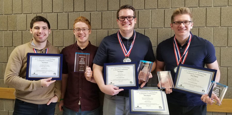 ​​​​​​​From left, UW-Stout students Jack Moore, Tyler Elwood, Pierce Lannue and Stephen Felton hold their awards.