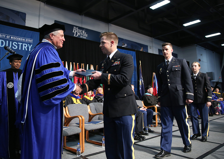 UW-Stout and Army ROTC graduates receive their diplomas during a 2018 commencement ceremony at UW-Stout.