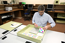 Sean Conley, a graduate assistant in the Vocational Assessment class, demonstrates various assessment tools in the Vocational Evaluation Lab 