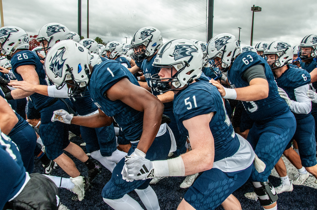 Blue Devil football players prepare to rush the field.