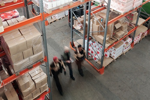 Image of people walking in a warehouse 