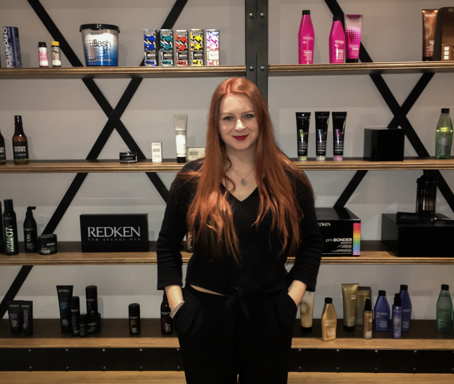 Anna Haggerty next to Redken products at L'Oreal.