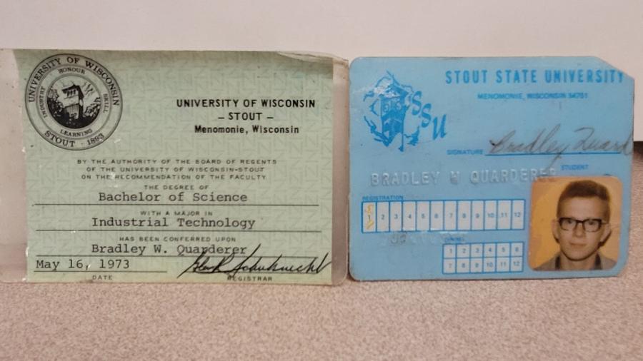 A close-up of Bradley Quarderer's graduation card and found student ID.