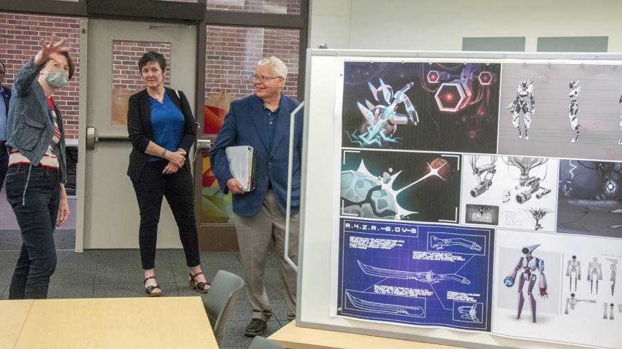 Jay Rothman visits the game design and development lab at UW-Stout with Kim Loken, left, associate professor, and Tamara Brantmeier, associate vice chancellor of Partner and Student Engagement.