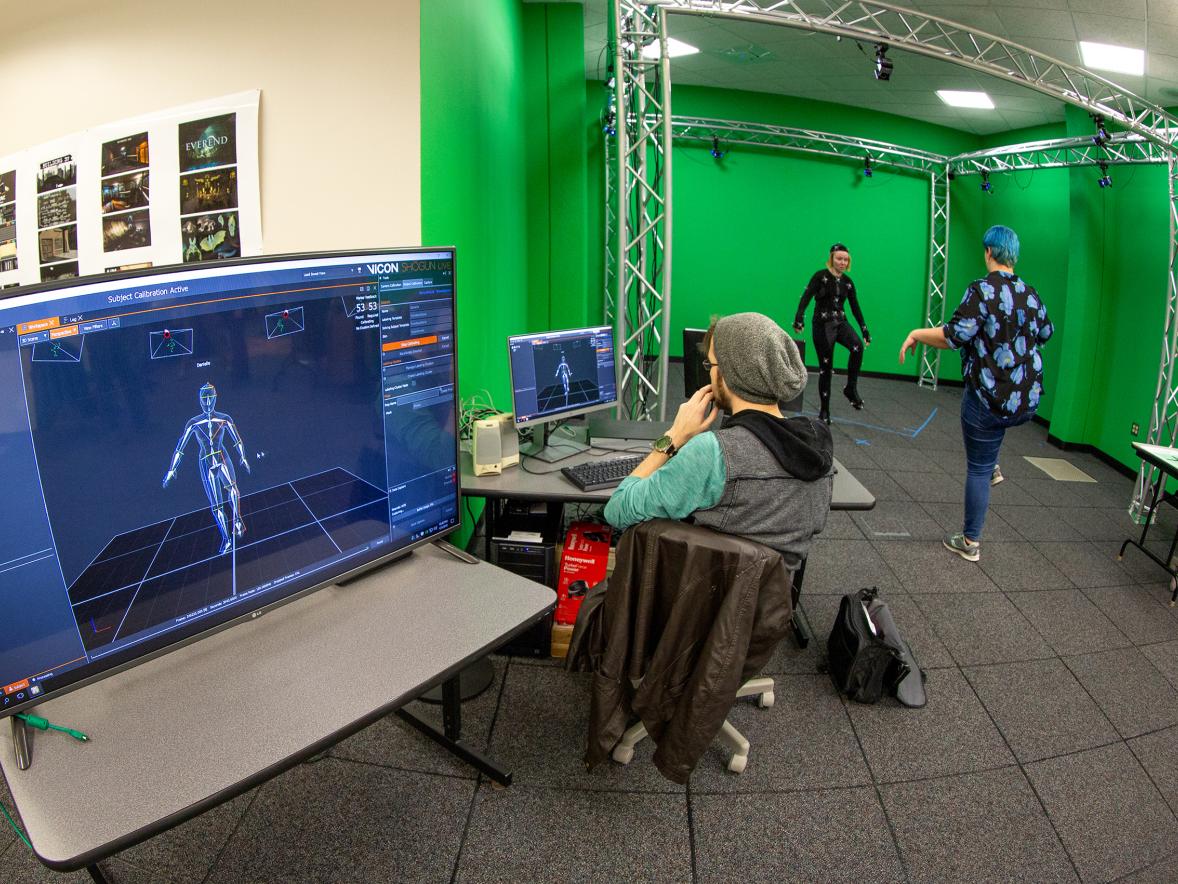 Andrew Fedie, left, watches the movements of fellow student Danielle Pedersen as she is directed by Kayla Techmeier in UW-Stout’s new motion capture studio in Micheels Hall.