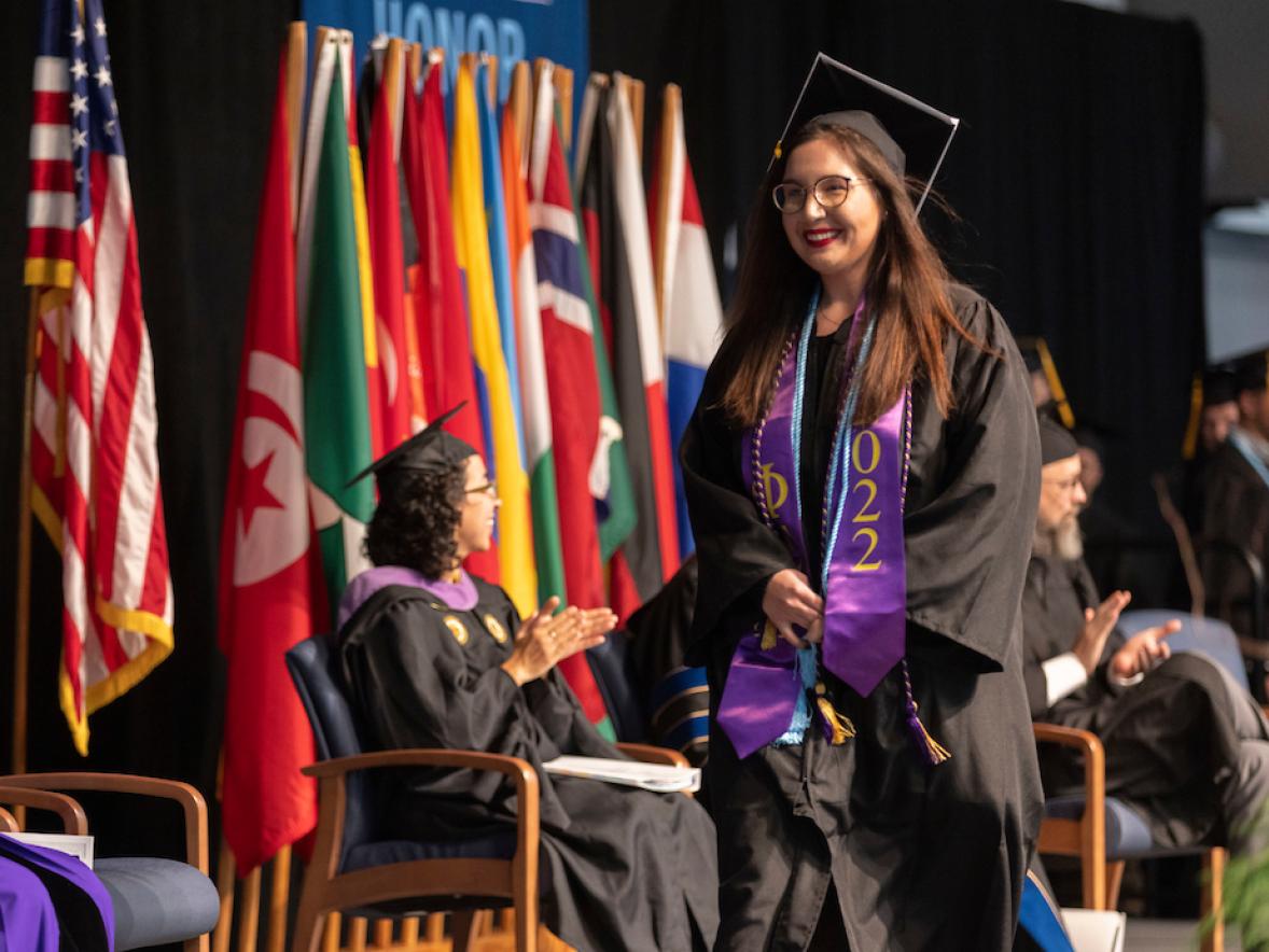 Jade Krol crosses the commencement stage on Dec. 17.