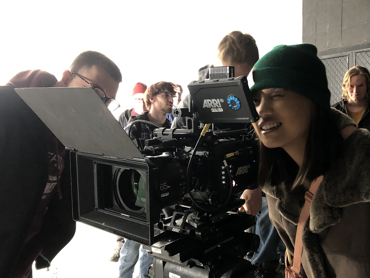 Student Delaney Hoffman looks through a viewfinder at Cinequipt on an Arri Alexa camera, used for high-end motion imaging.