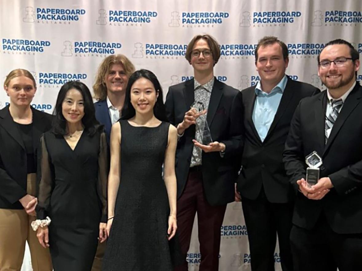 UW-Stout students gather with Assistant Professor Kate Liu, second from left, and their awards at the PPA event in San Diego. They are, from left, Erika Jackett, Zach Hoffmire, Starr Gong, Ethan Myers, Lukas David and Buddy Moreno.