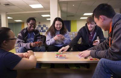 Students playing Uno, the card game