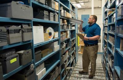 Adam Karis, a UW-Stout graduate student in the Operations and Supply Management program, works in the 3M Plant Engineering Stockroom.