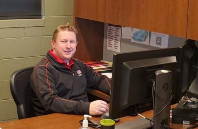 Shaun Zahradka, online management graduate, in his office at Lincoln Electric’s facility in Bettendorf, Iowa.
