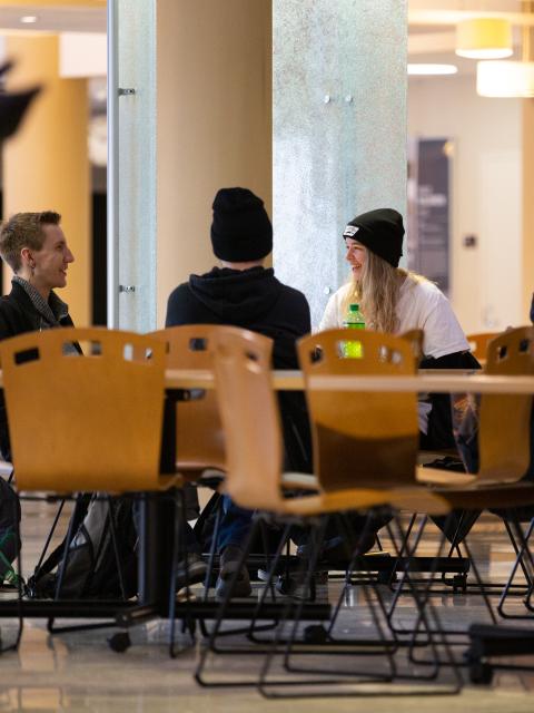 Students talking at a table
